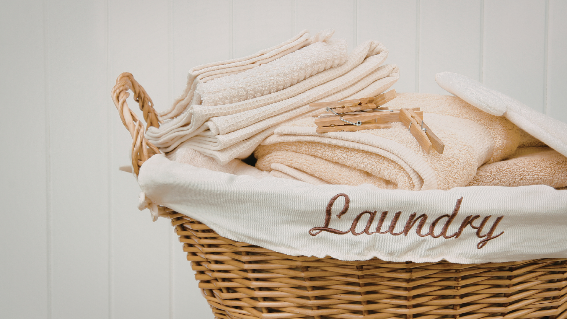 Folded towels in a laundry basket